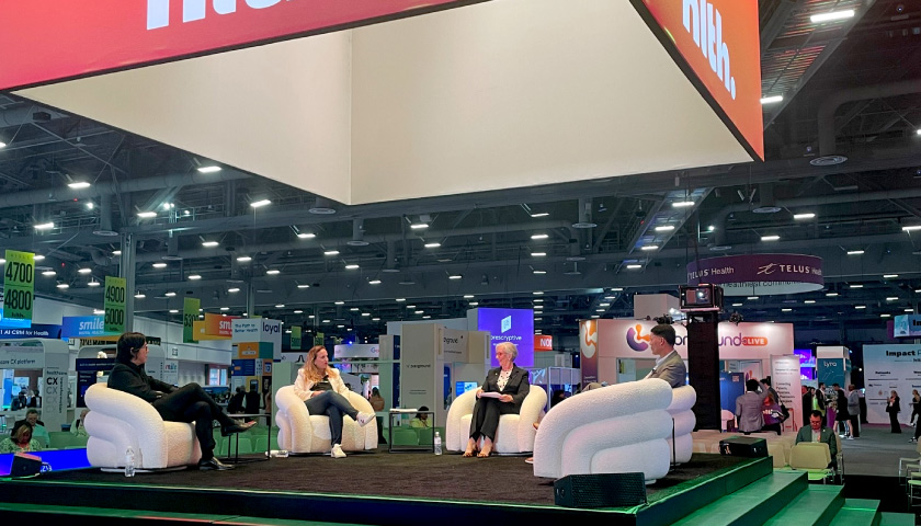 Cleerly CEO Jim Min speaking on a panel at HLTH 2023